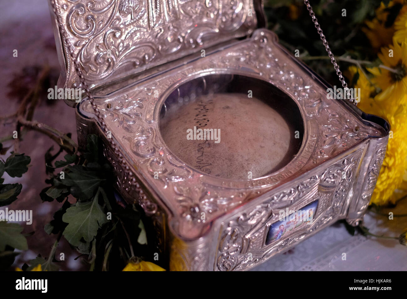 View of a silver reliquary case with a piece of a skull that is said to be a relic of Neomartyr Panagiotis an orthodox martyr inside the Greek Orthodox Church and Monastery of Saint John the Baptist located in the Christian Quarter Old city East Jerusalem Israel Stock Photo
