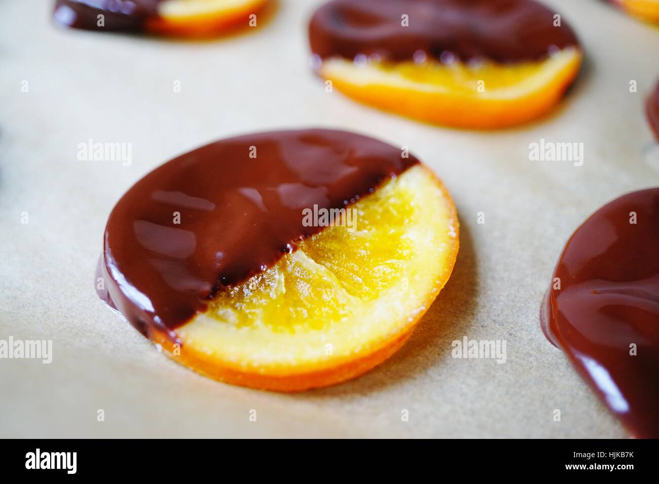 Making candied orange slices dipped in dark chocolate Stock Photo Alamy