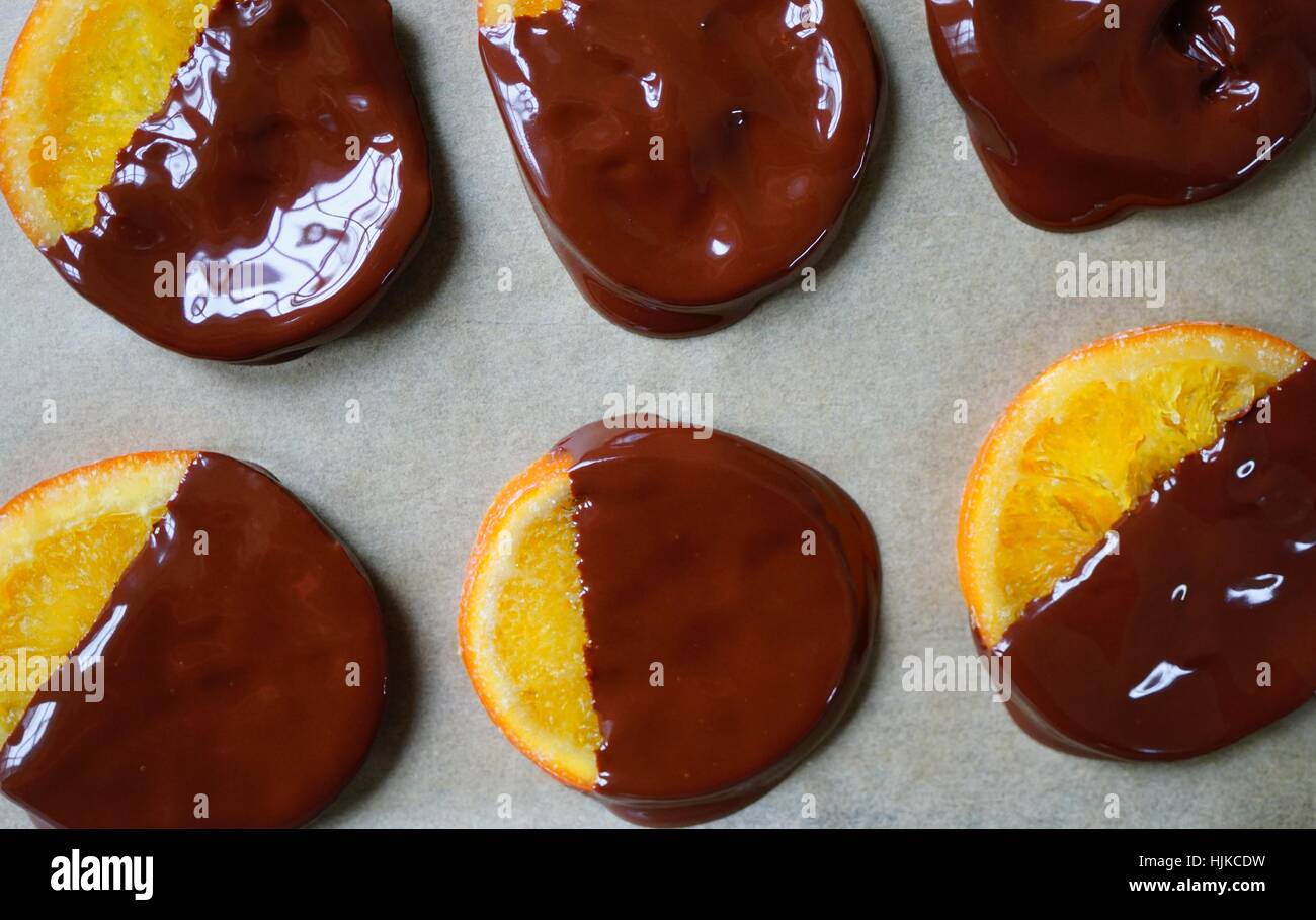Making candied orange slices dipped in dark chocolate Stock Photo Alamy