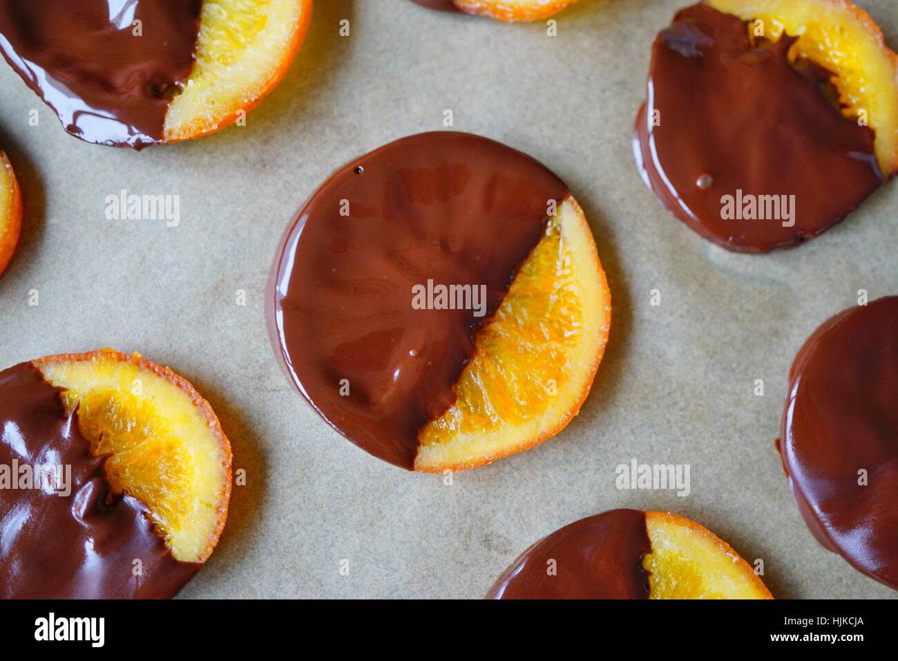 Making candied orange slices dipped in dark chocolate Stock Photo Alamy