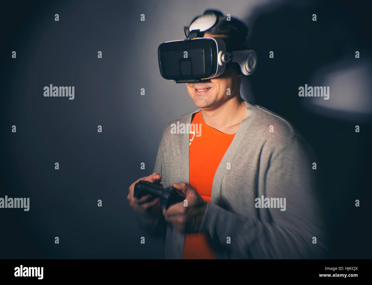 Man wearing virtual reality goggles. Play video games Stock Photo Alamy
