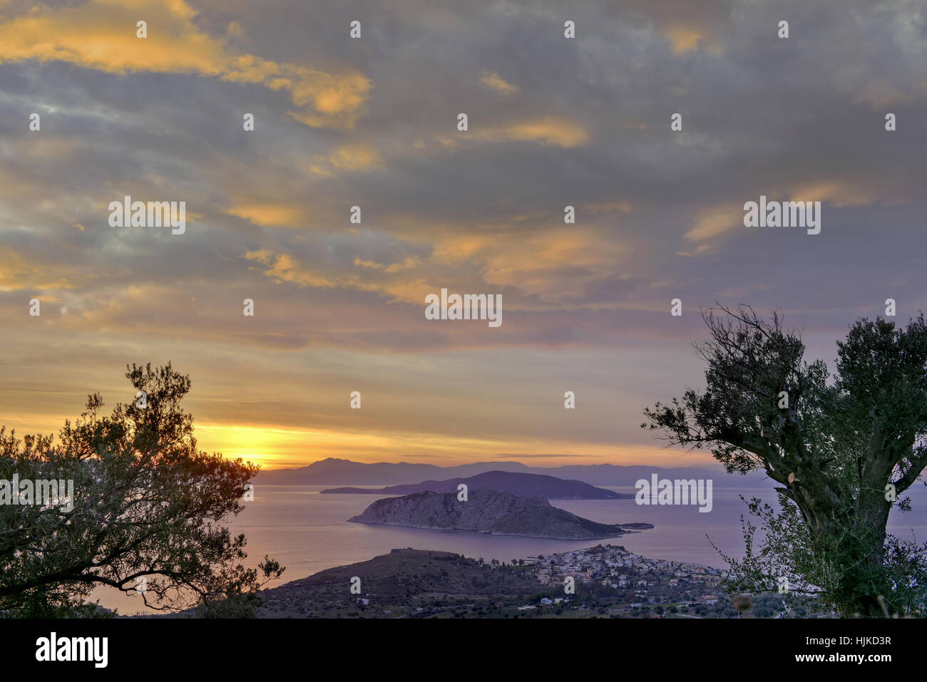 Sunset at Perdika village and Moni islet in the Aegina island located in the Saronic gulf, near Athens, Greece Stock Photo