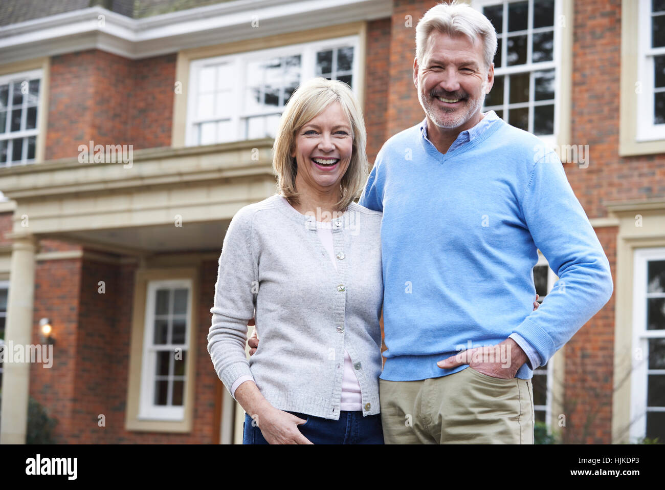 Portrait Of Mature Couple Standing Outside Home Stock Photo - Alamy