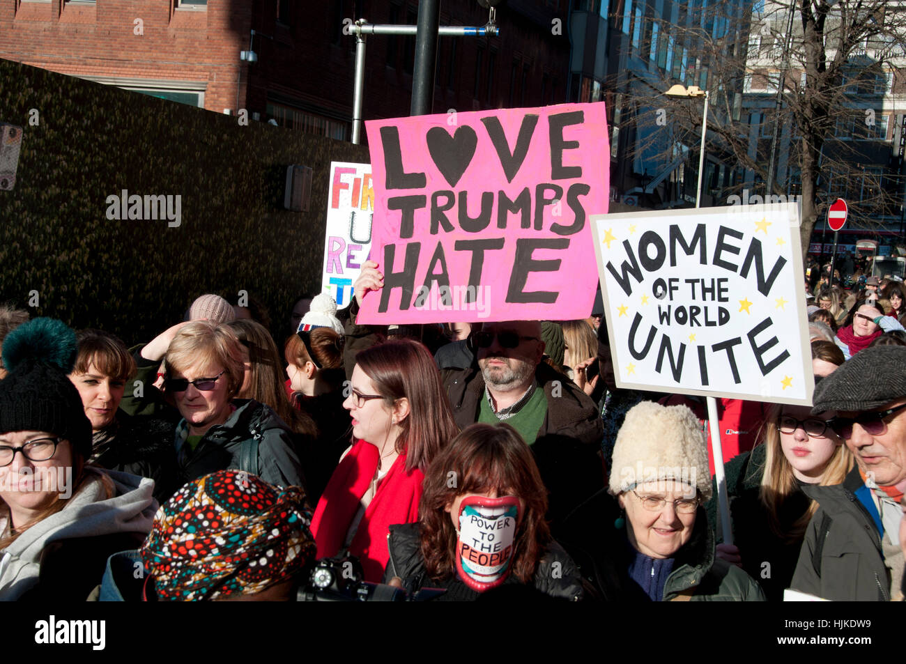 Women's anti-Trump march, London. Placards saying 'Love trumps hate' and 'Women of the world unite'. Stock Photo
