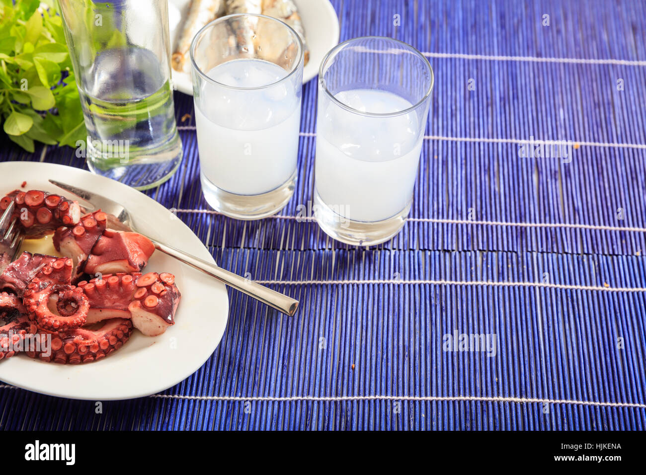 Glasses of ouzo and appetizers Stock Photo