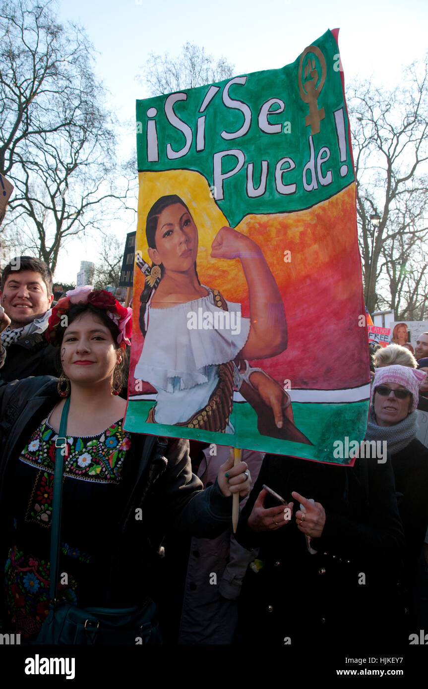 Anti-Trump Women's March A Latina woman holds a placard saying 'Yes we can in Spanish ( Si se puede ). Stock Photo