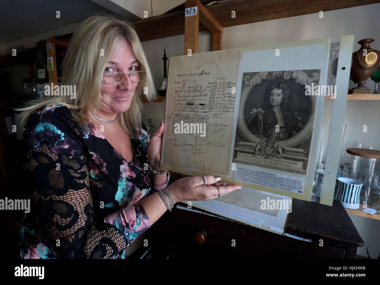 Christine Tarr holds a signature of the Duke of Buckingham which was one more than 1,000 signatures of famous historical figures from the past five centuries, collected by John Evans before his death aged 90 in 2007, auctioned by Campbells Auctioneers in Worthing, West Sussex. Stock Photo