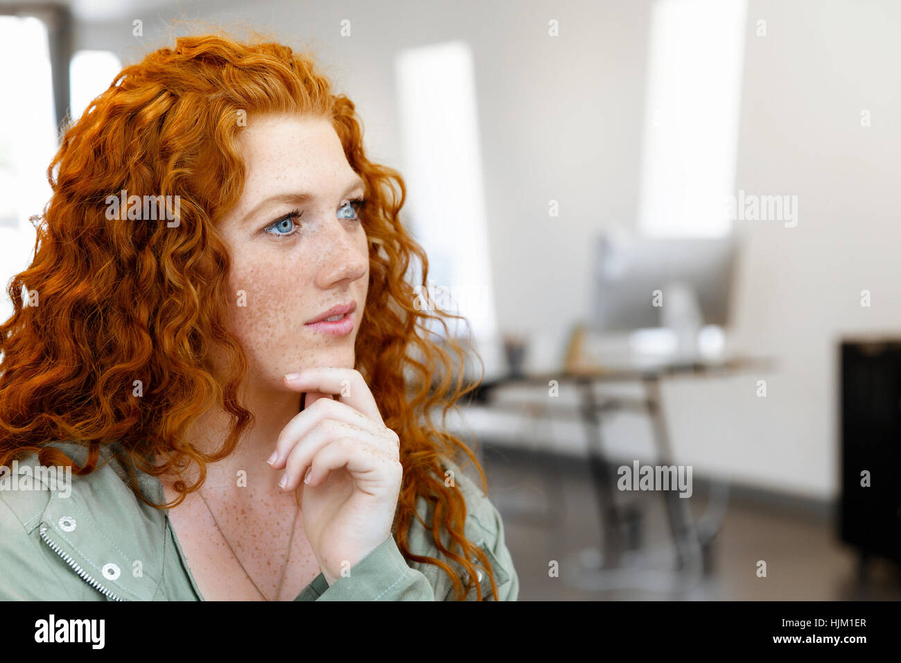 Young and pretty business woman in office Stock Photo - Alamy