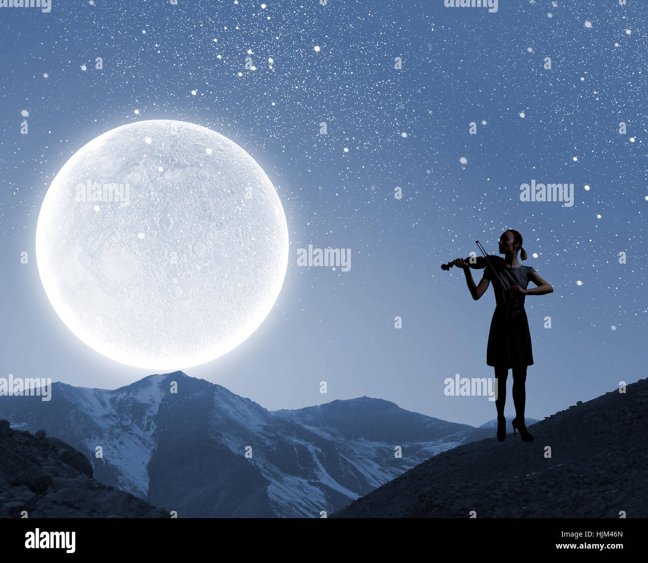 Silhouette of woman playing violin at night Stock Photo - Alamy