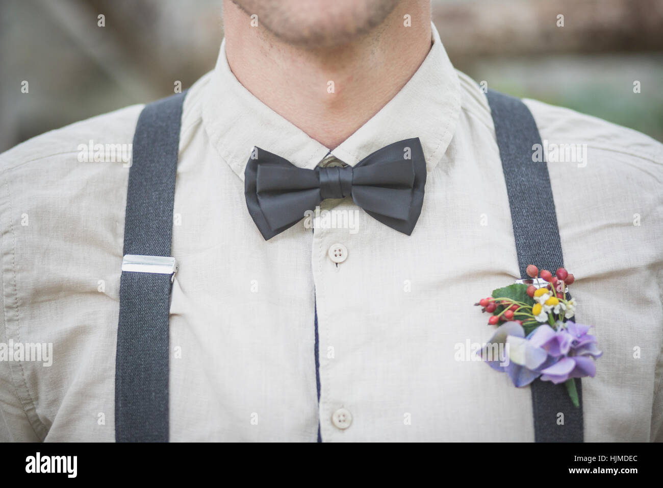Close-up of groom wearing floral decoration Stock Photo