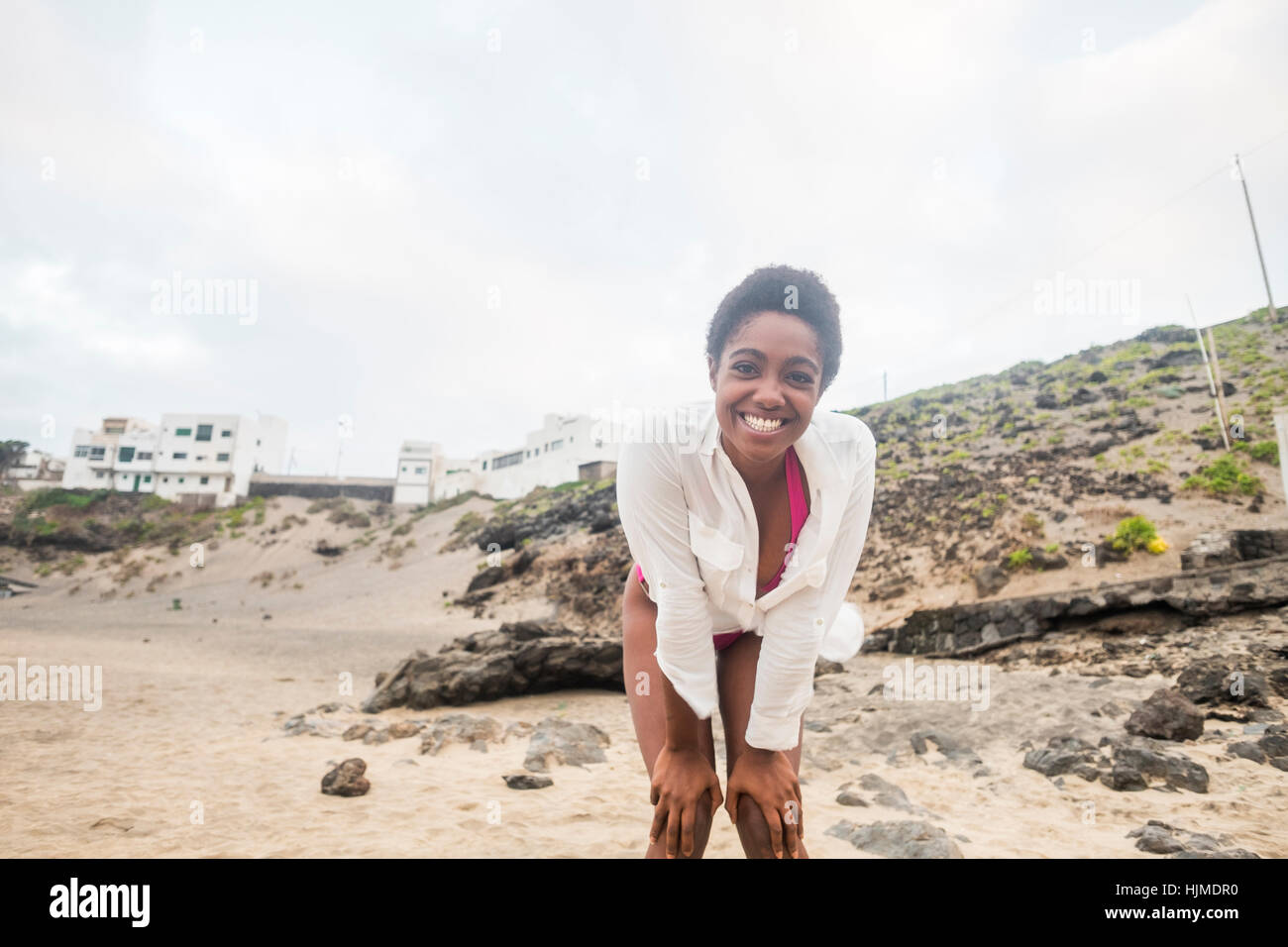 Portrait of happy young woman on the beach Stock Photo - Alamy