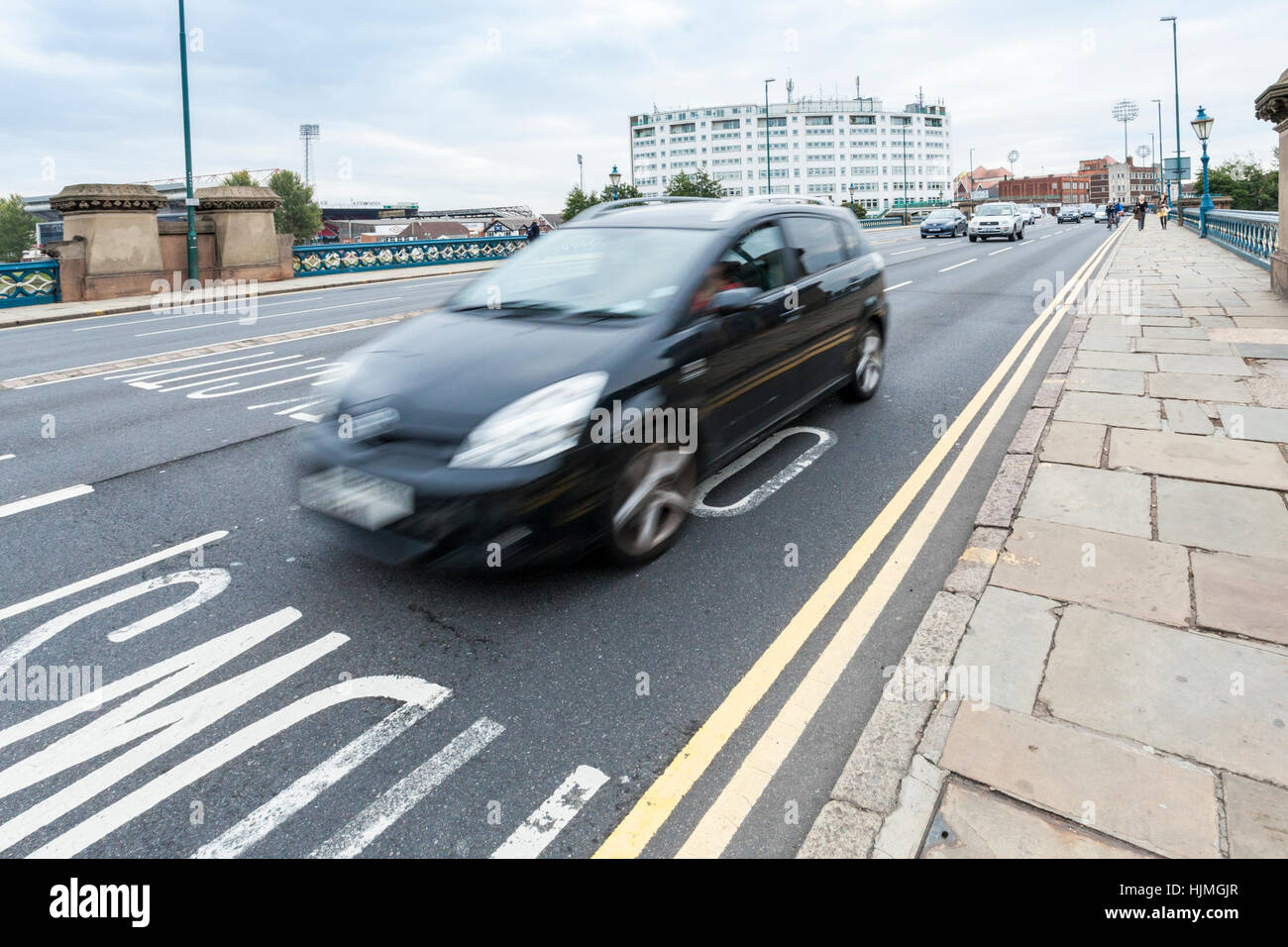 Fast car on a main road into the city of Nottingham, England, UK Stock