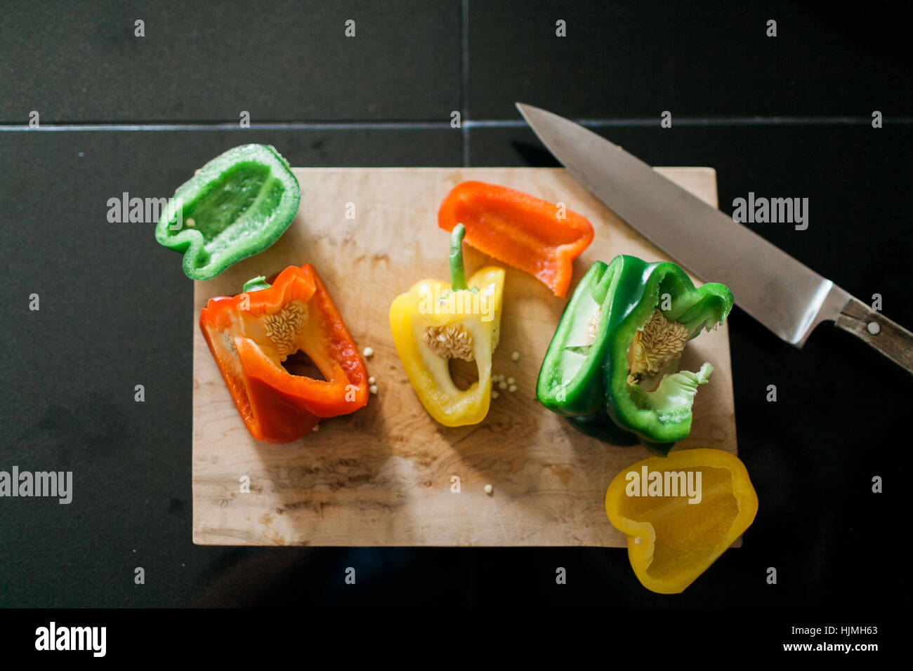 Cutting board with chopped bell peppers Stock Photo - Alamy