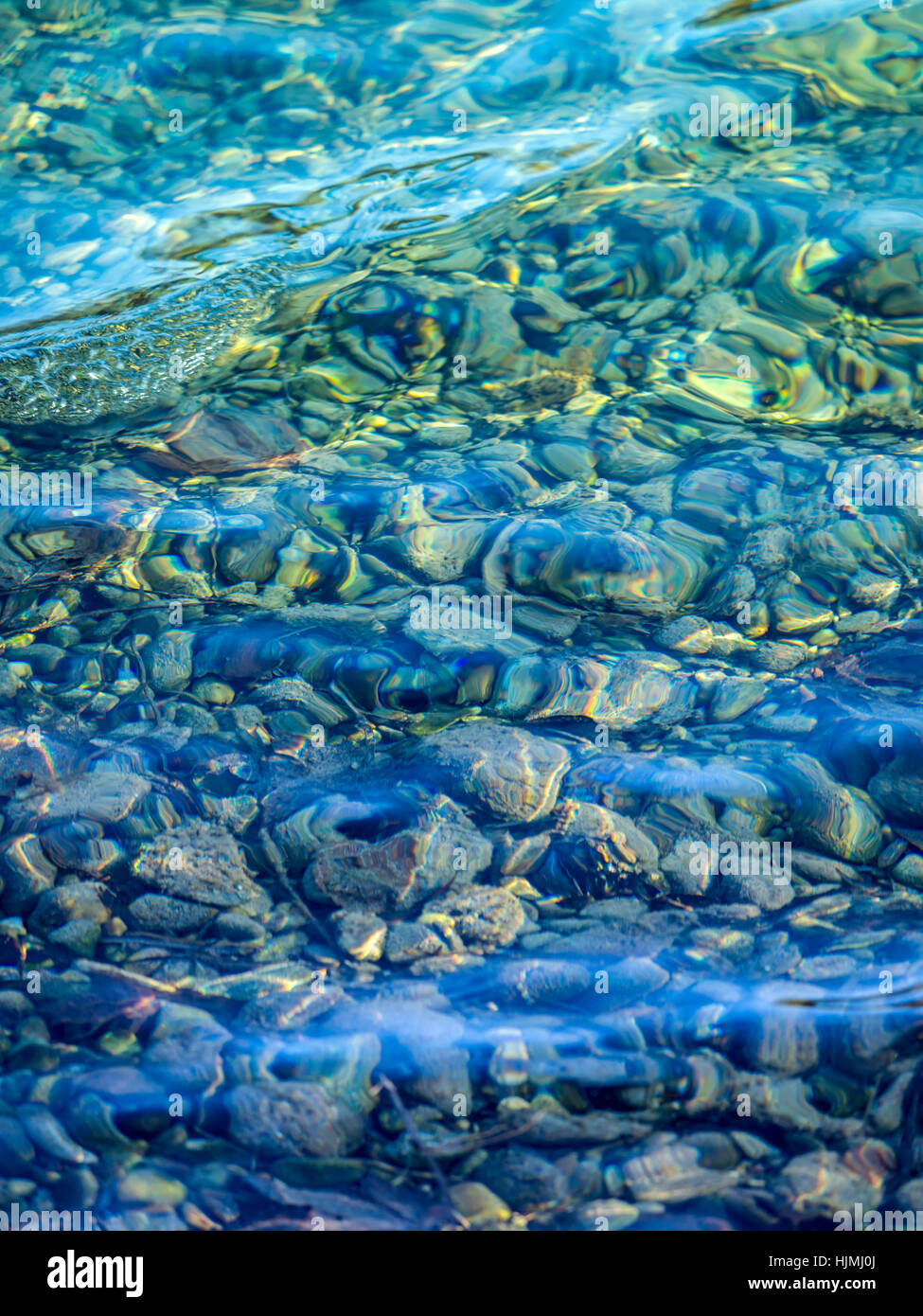 Pebbles under clear water of a lake Stock Photo