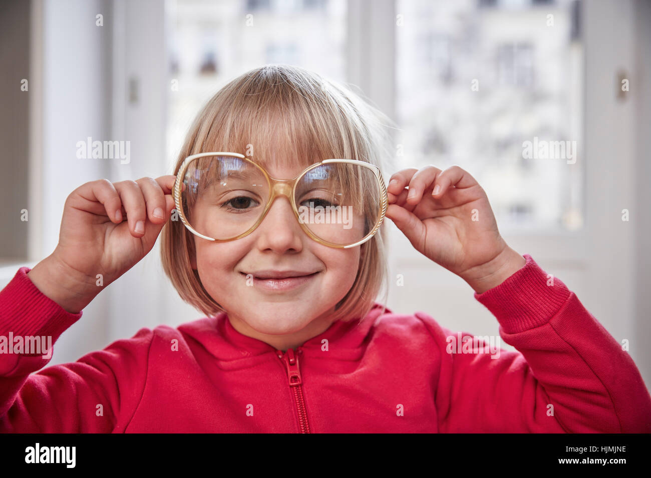 Portrait of girl wearing oversized glasses Stock Photo Alamy