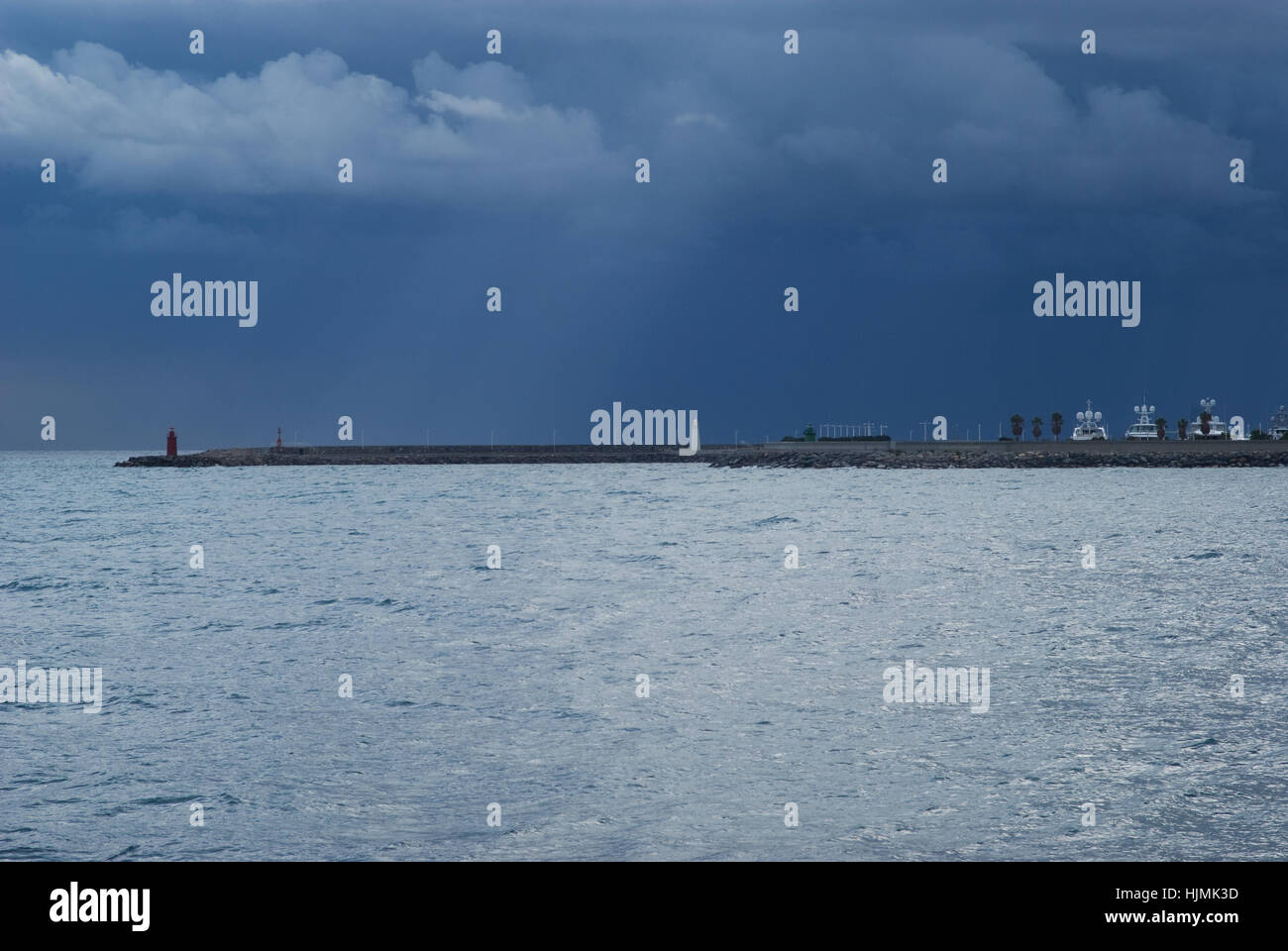 Dark cumulus clouds hovering over the sea Stock Photo Alamy
