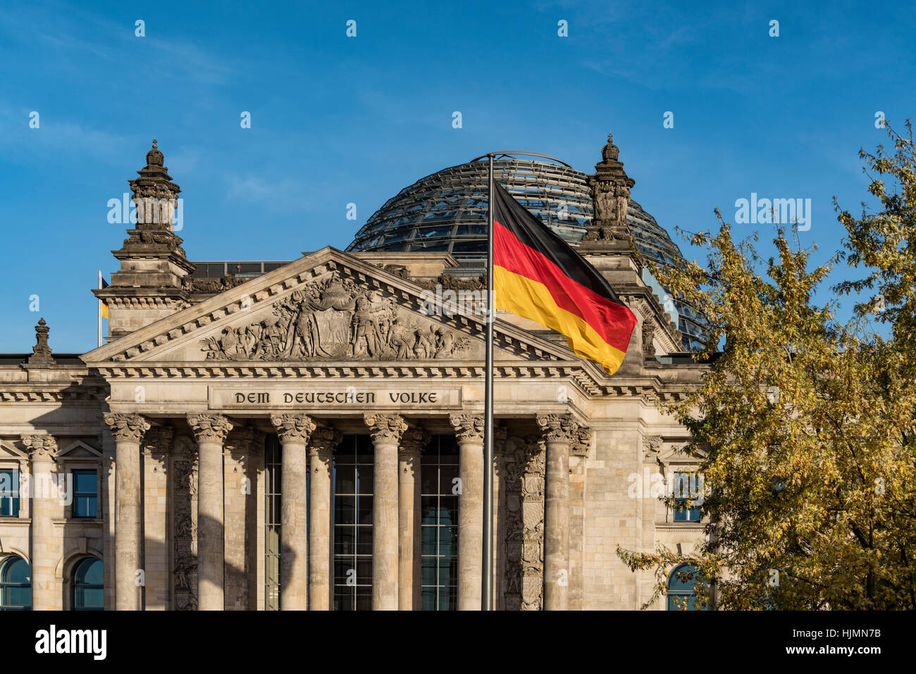 German National Flag in front of Reichstag, Berlin Stock Photo