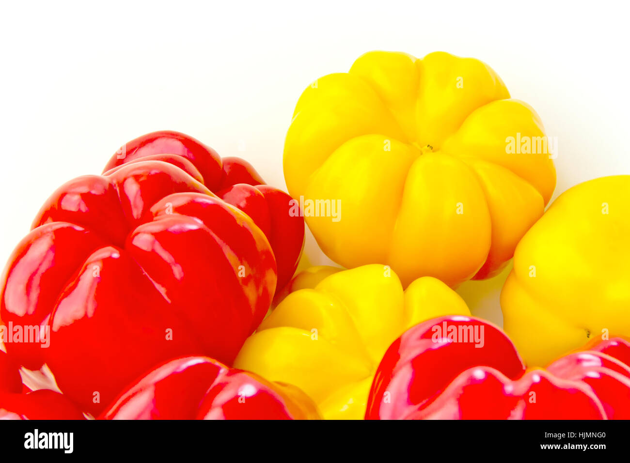 Photo of red and yellow raw pepper on white background Stock Photo - Alamy
