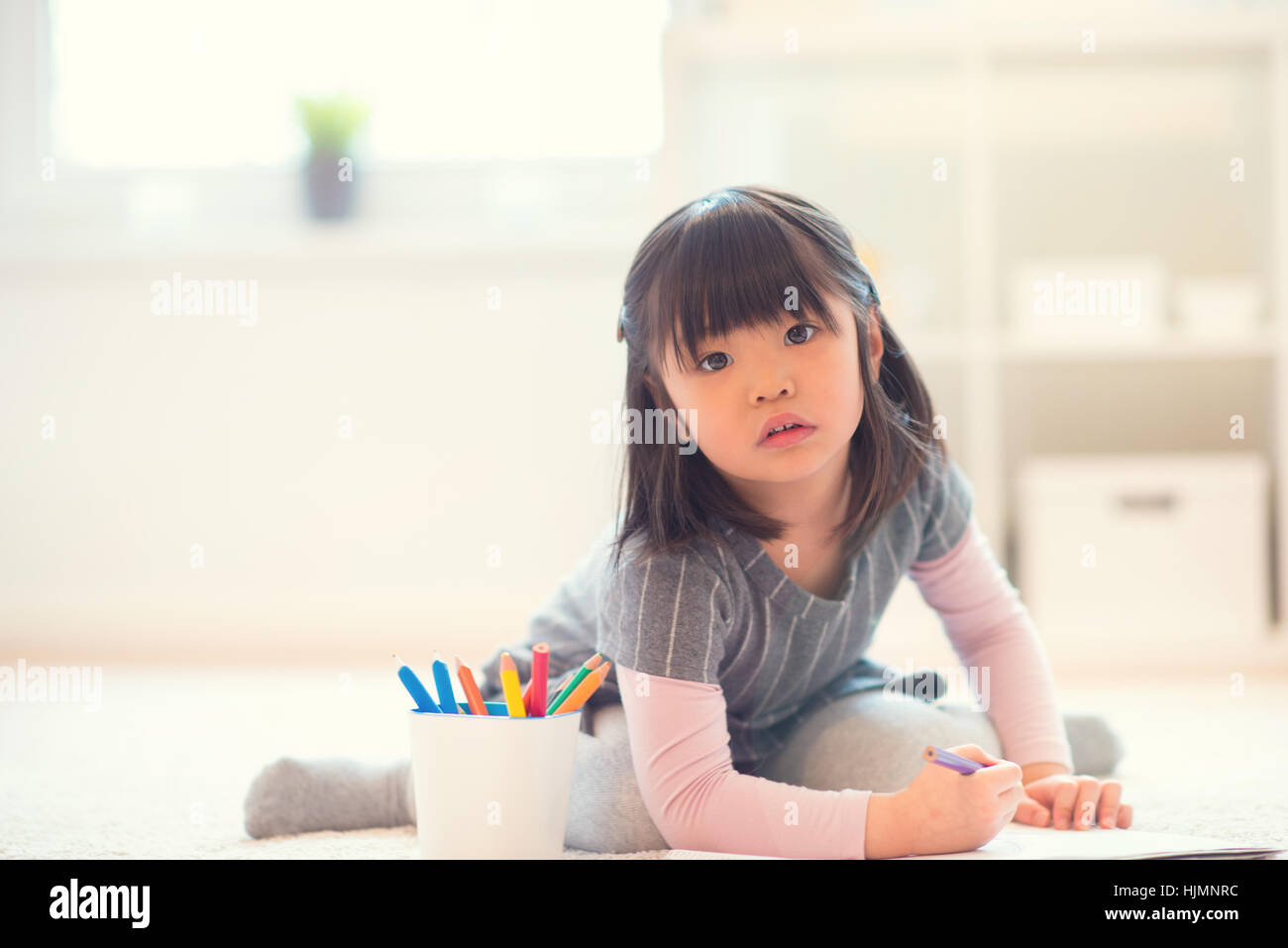 Pretty Happy Little Japanese Girl Lying And Drawing With Pencils On Stock Photo Alamy Pretty Happy Little Japanese Girl Lying And Drawing With Pencils On Stock Photo Alamy