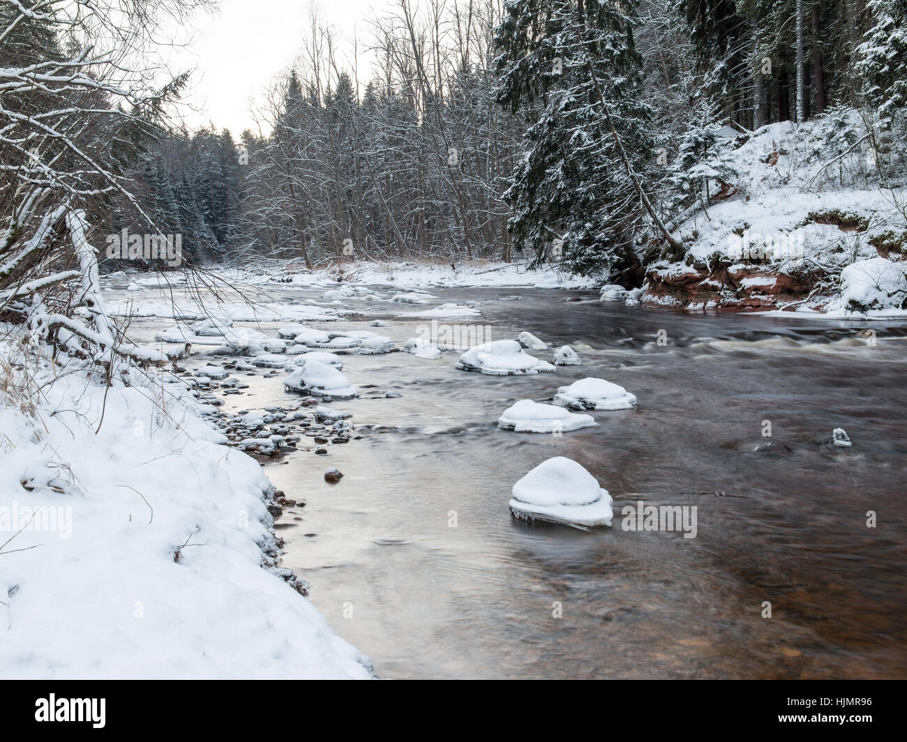 Frozen winter river landscape with ice and snow Stock Photo - Alamy