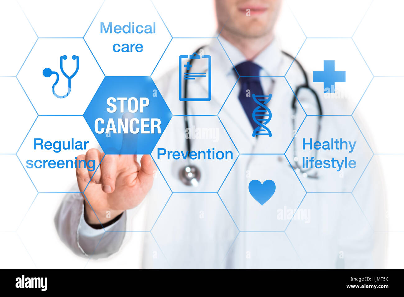 Cancer prevention and awareness concept with icons and words on screen and medical doctor touching a button Stock Photo