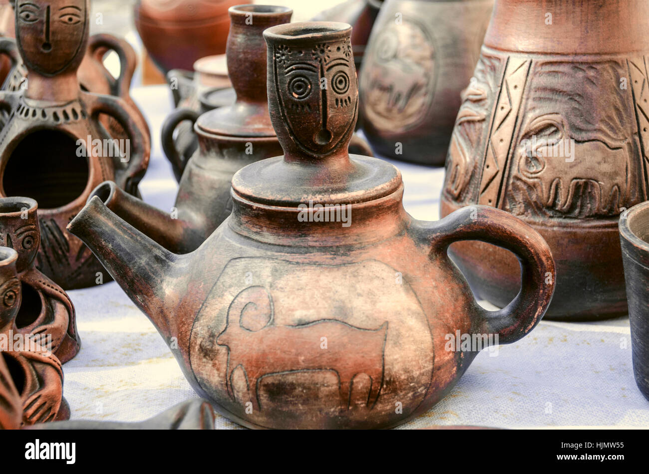 Souvenirs of clay teapots with relief ornament Stock Photo Alamy