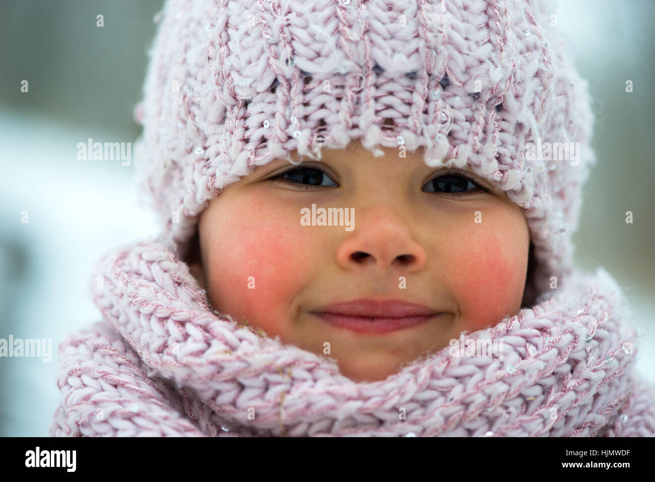 Little girl in winter season with red cheeks Stock Photo Alamy