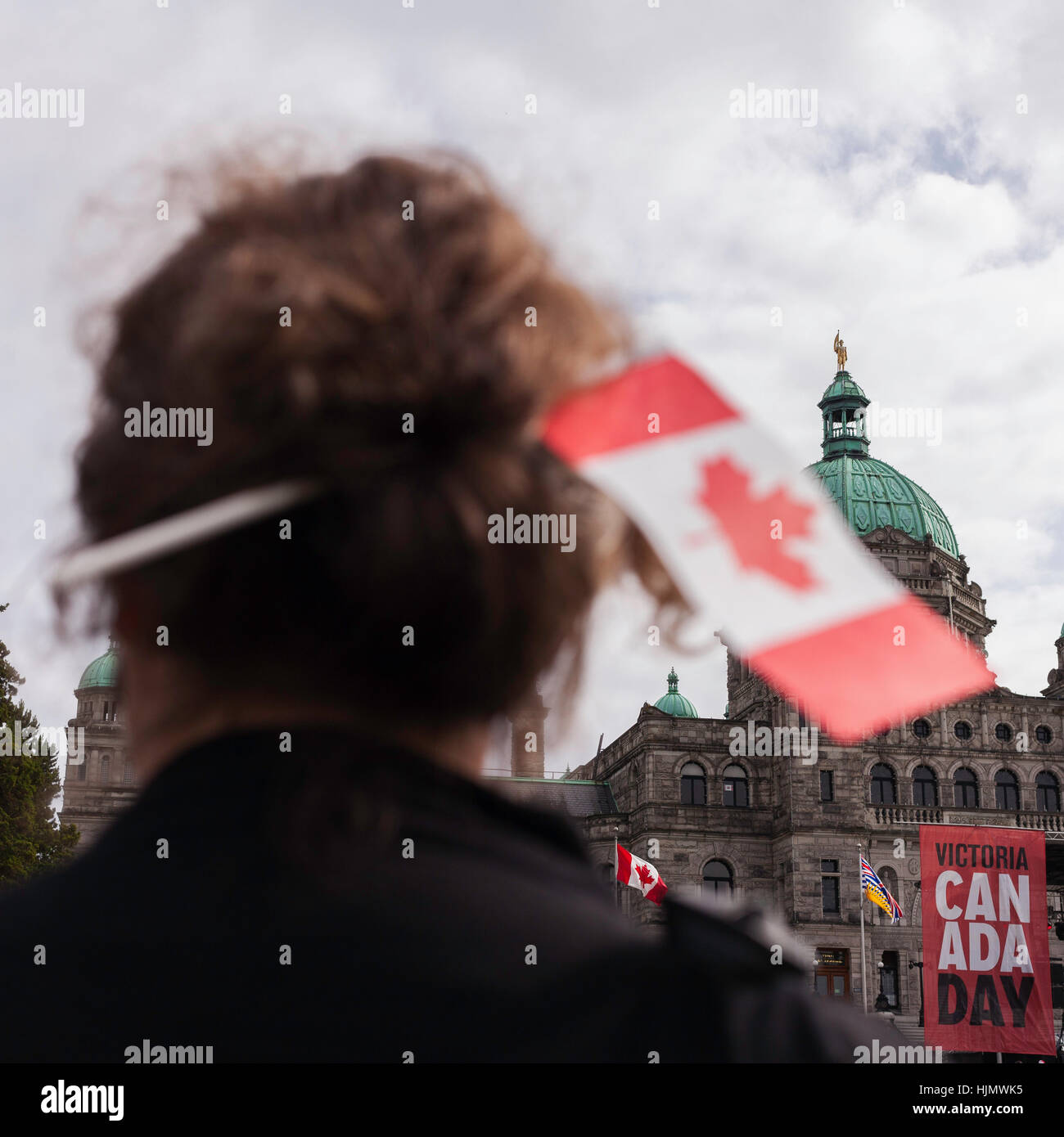 Woman with Canadian flag in hair on Canada Day.  Victoria, BC. Canada Stock Photo