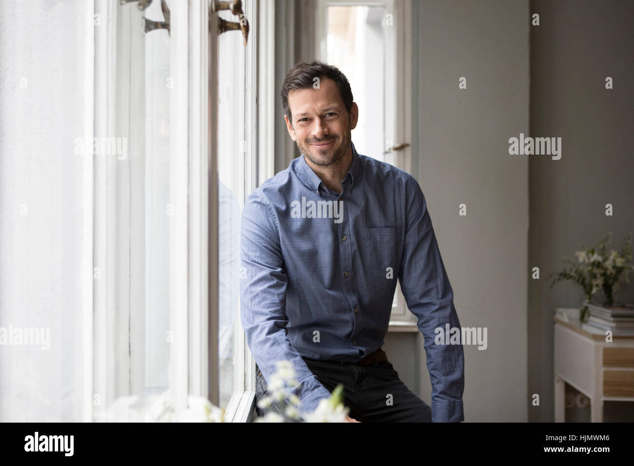 Portrait of content man at home Stock Photo