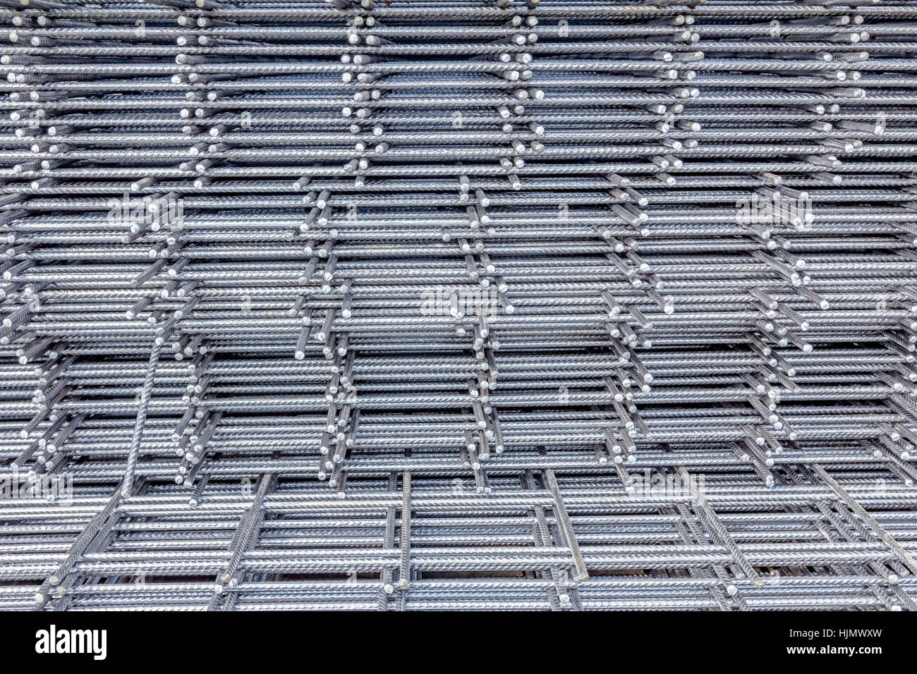 Spikes of rebar grid, reinforcing mesh, steel bars stacked for