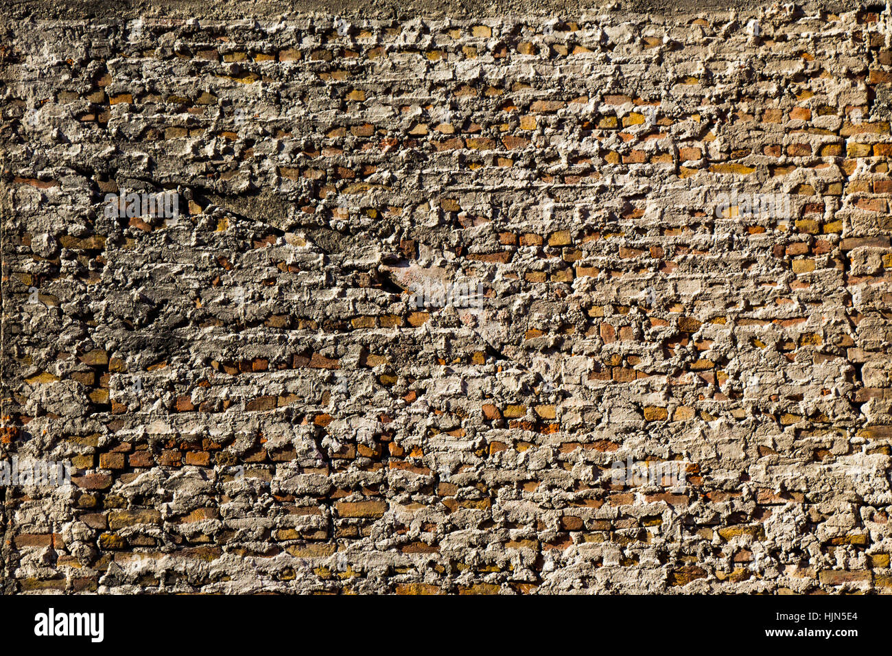 Old grunge brick wall as a background Stock Photo - Alamy