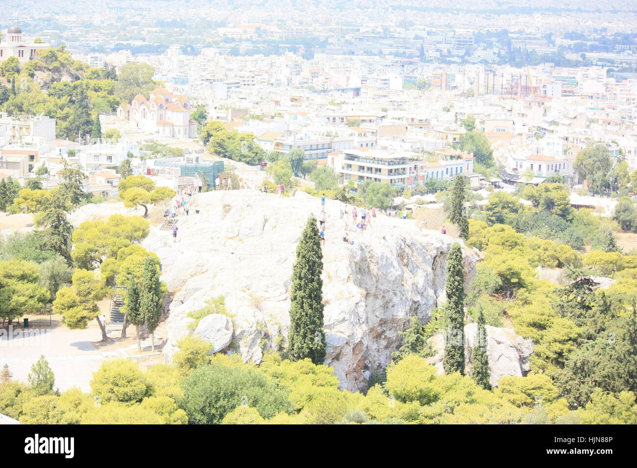 The rock of Areopagus and blurry background of Athens Stock Photo