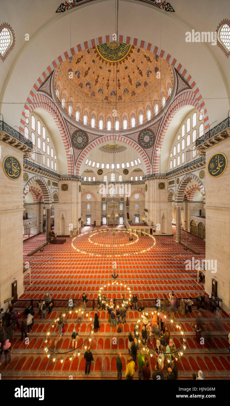 ISTANBUL - TURKEY, APRIL 26; People and tourists visit Suleymaniye Mosque on May 26, 2014. Suleymaniye Mosque is in Fatih district of Istanbul, Turkey Stock Photo