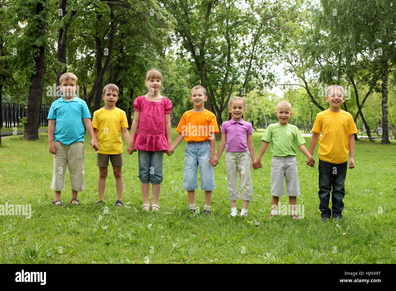 Group of children having fun together in the park Stock Photo - Alamy