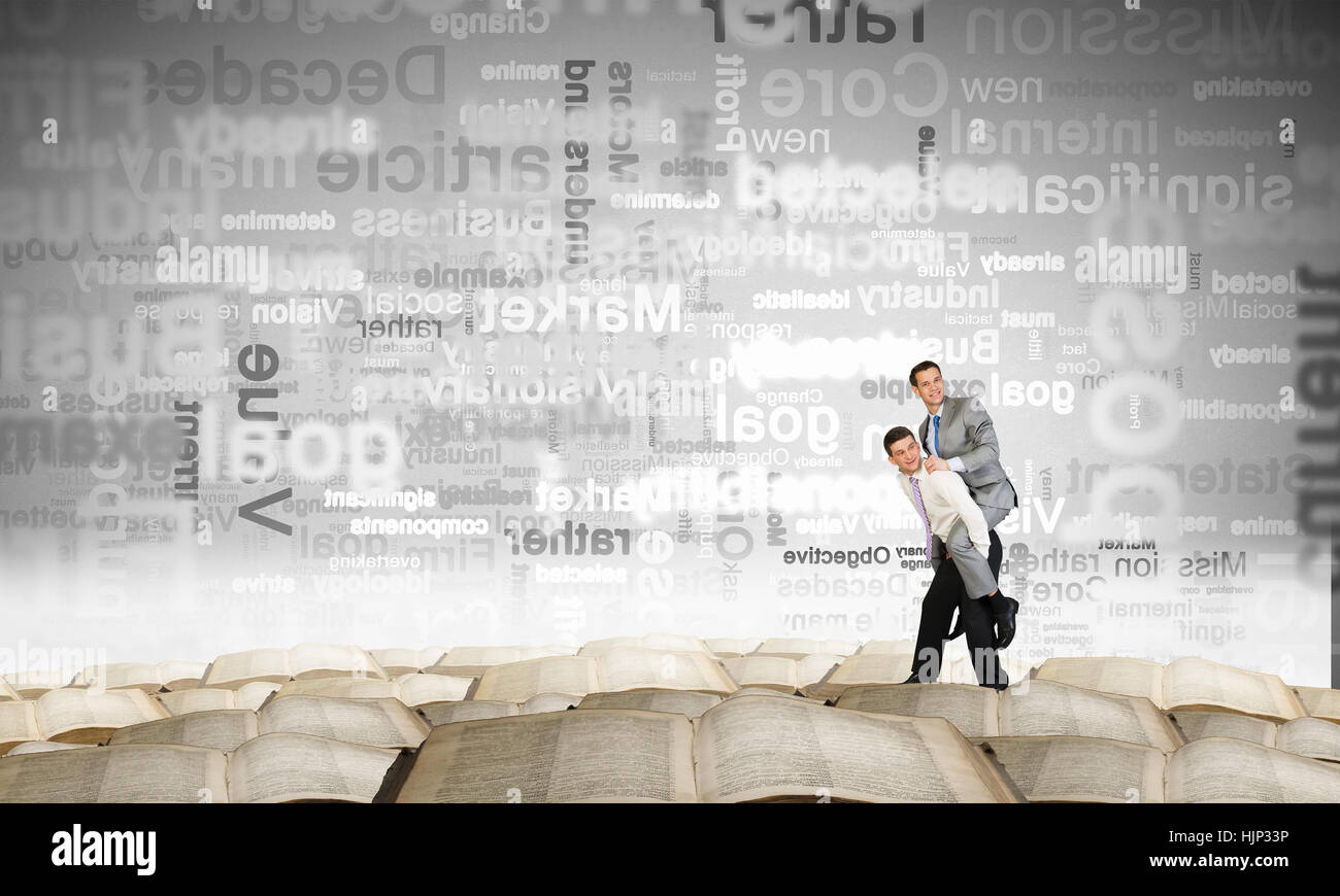 Businessman riding on back of his colleague Stock Photo - Alamy