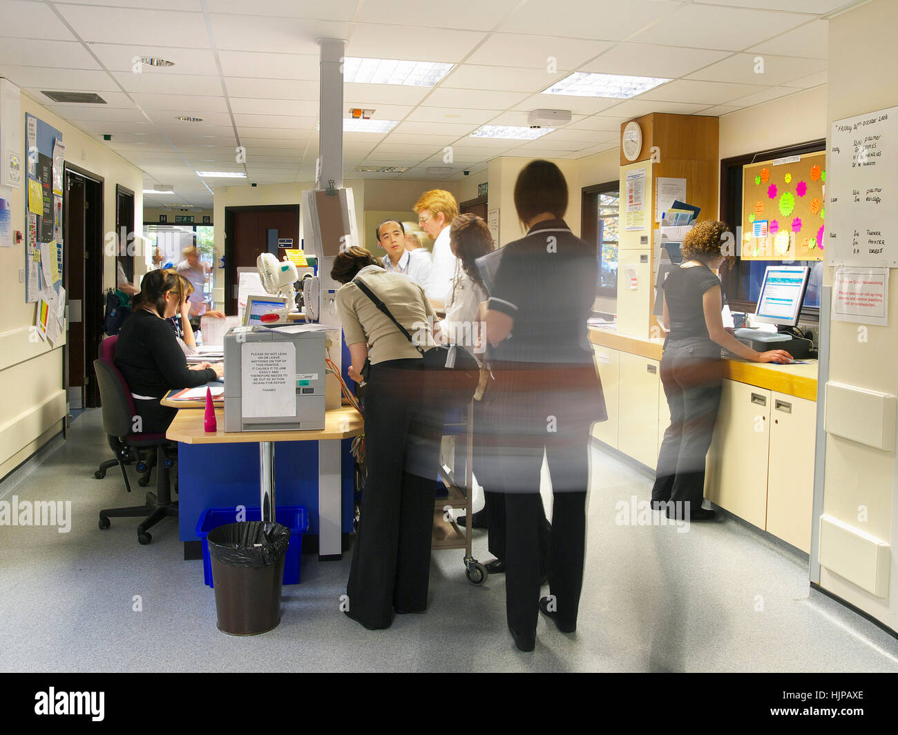 Hectic and very busy NHS hospital ward, with lots of actions as nurses and doctors are blurred