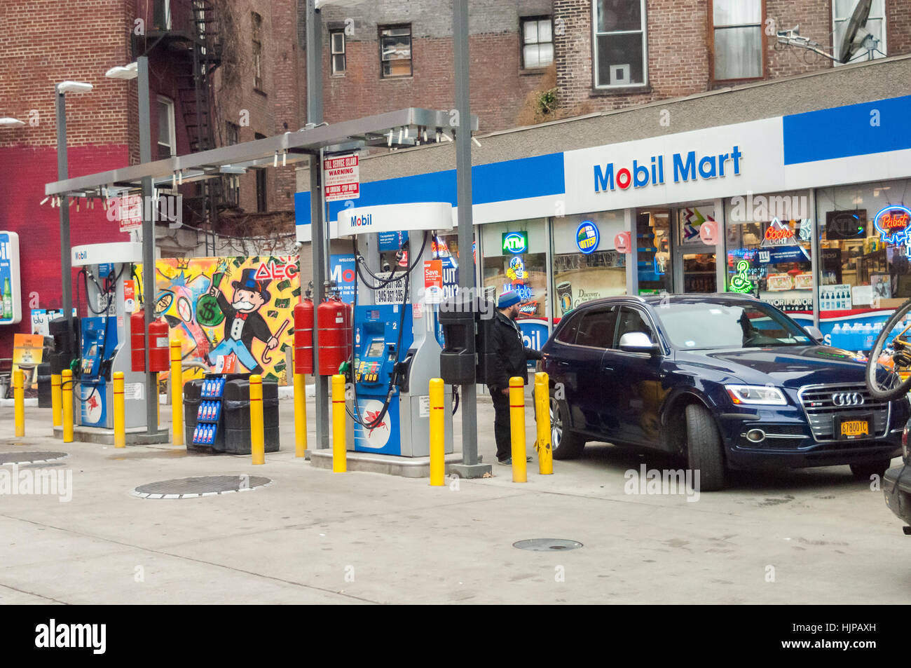A Mobil gas station in the Greenwich Village neighborhood of New York on Sunday, January 22, 2017. With rising real estate values in Manhattan the number of gas stations has been steadily shrinking over the years. This particular Mobil station is the last remaining gas station in Manhattan below 14th Street.  (© Richard B. Levine) Stock Photo