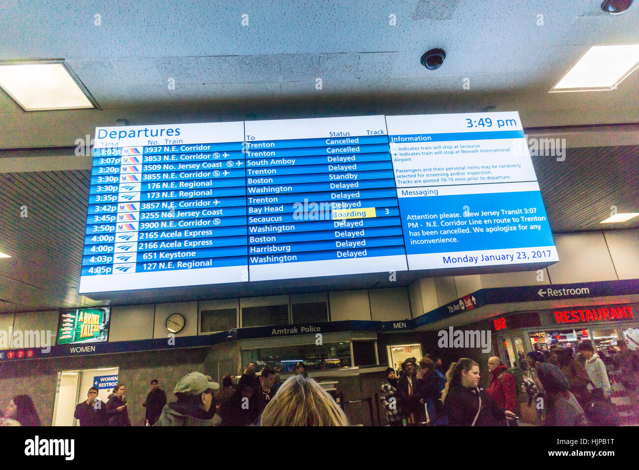 A digital Amtrak and NJ Transit departure board in Penn Station in New York on Monday, January 23, 2017 shows train service on Amtrak and NJ Transit has been severely disrupted with many trains cancelled because of the N'oreaster. (© Richard B. Levine) Stock Photo