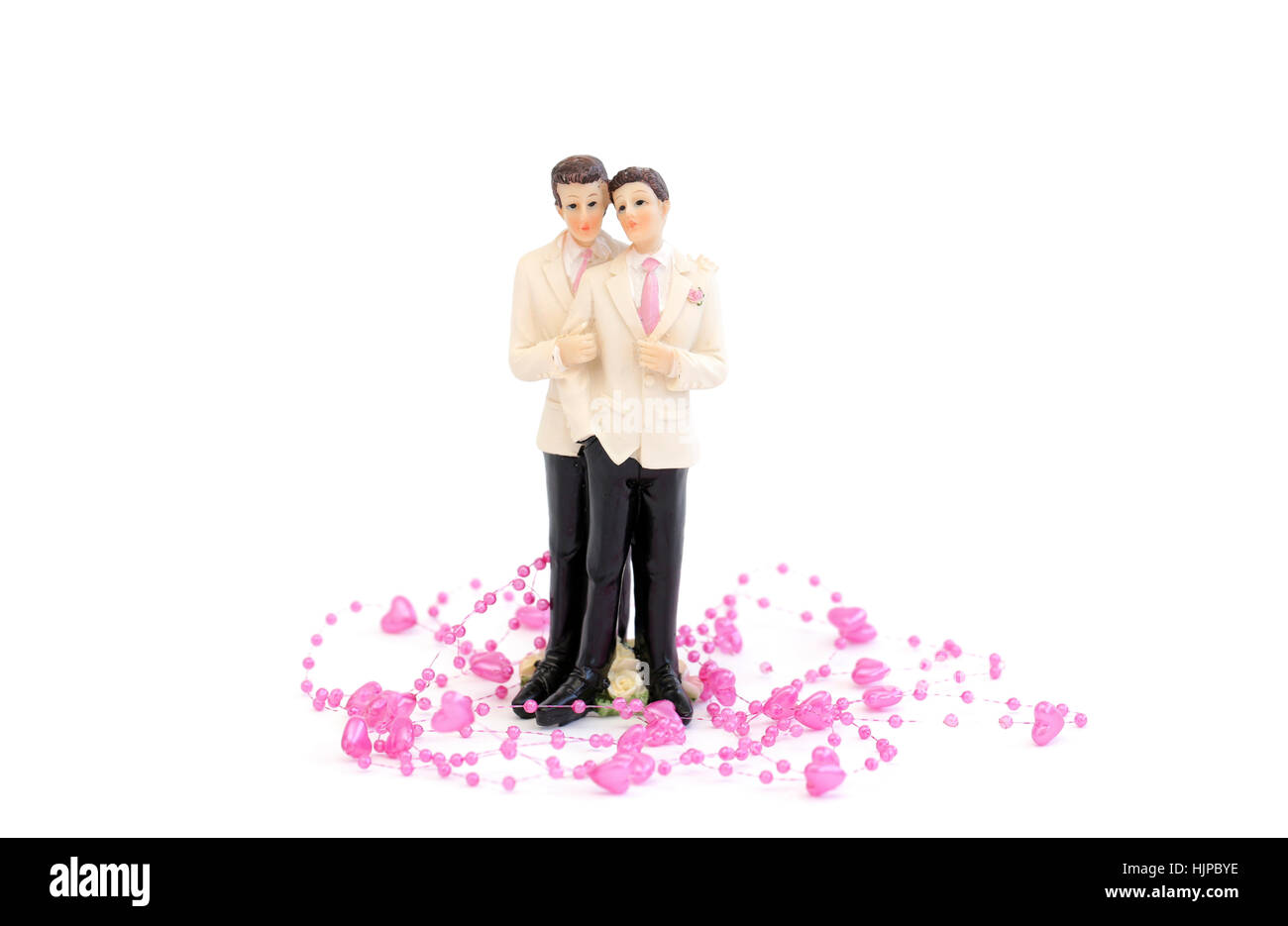 A homosexual couple with little pink hearts against a white background Stock Photo