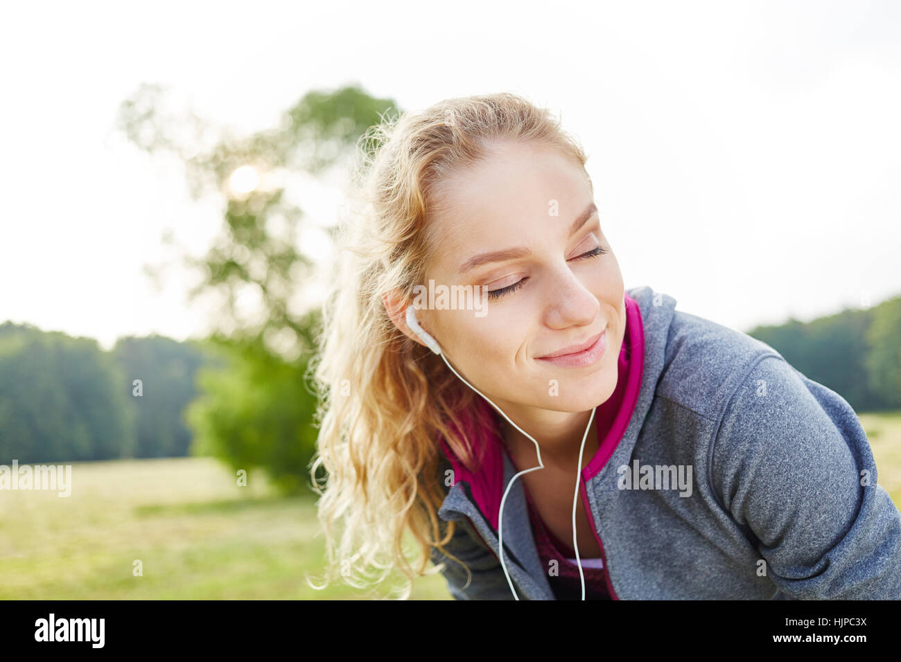 Young woman relaxing and enjoying her break from training Stock Photo