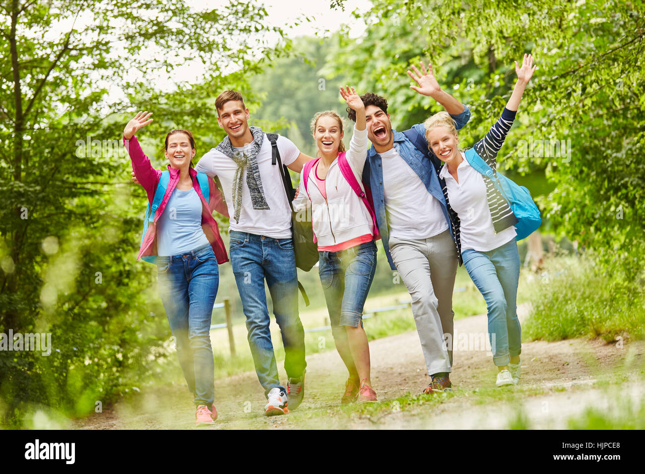 Group of hiking friends having fun and laughing Stock Photo