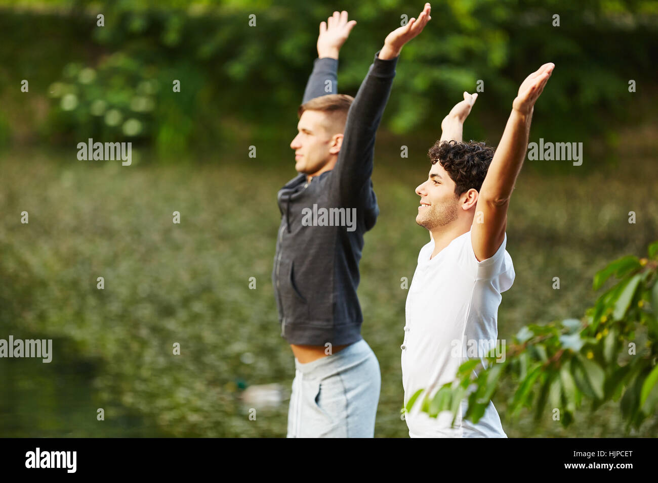 Men doing stretching exercise for warm up Stock Photo