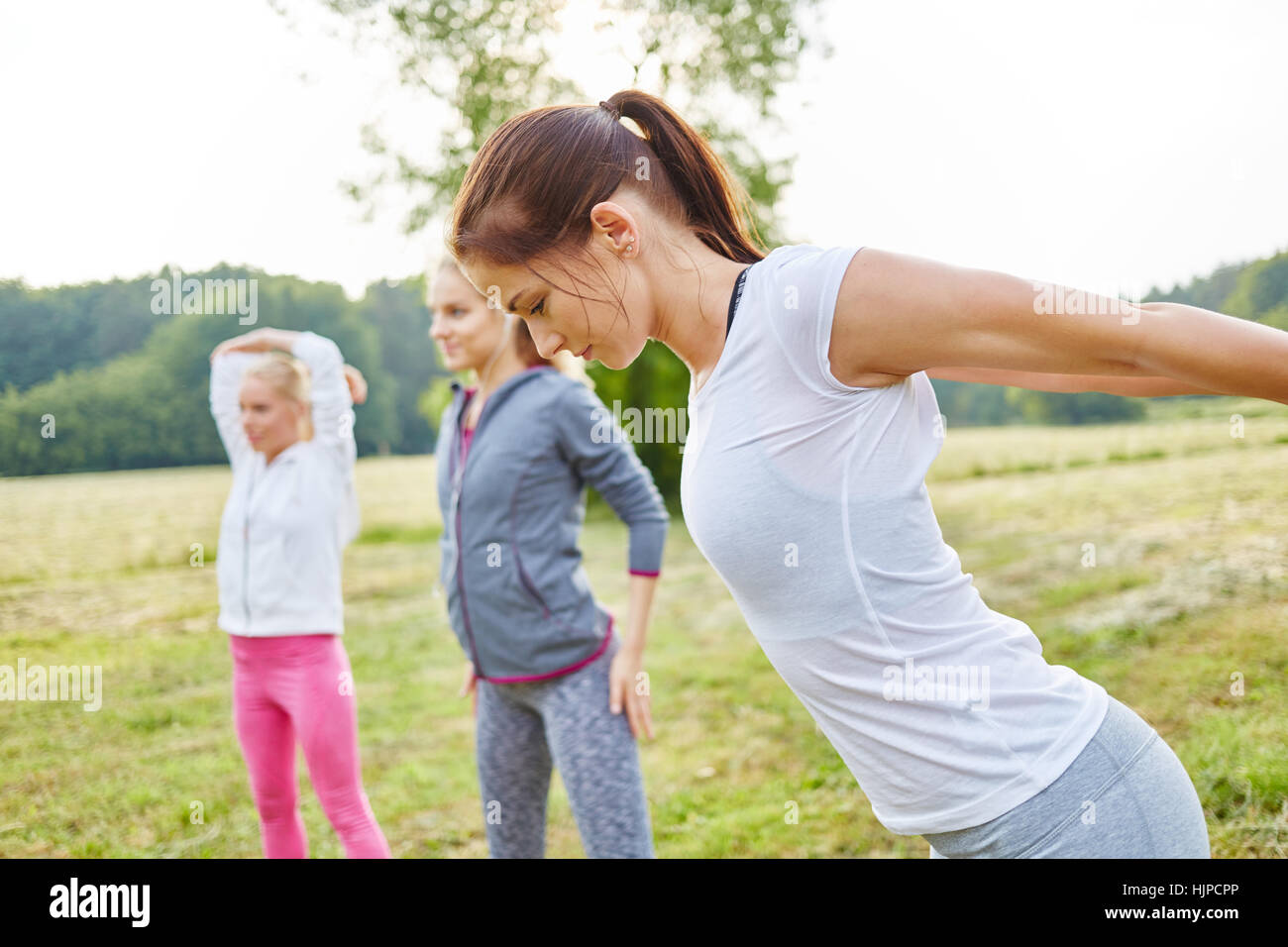 Women training as group at their fitness health class Stock Photo