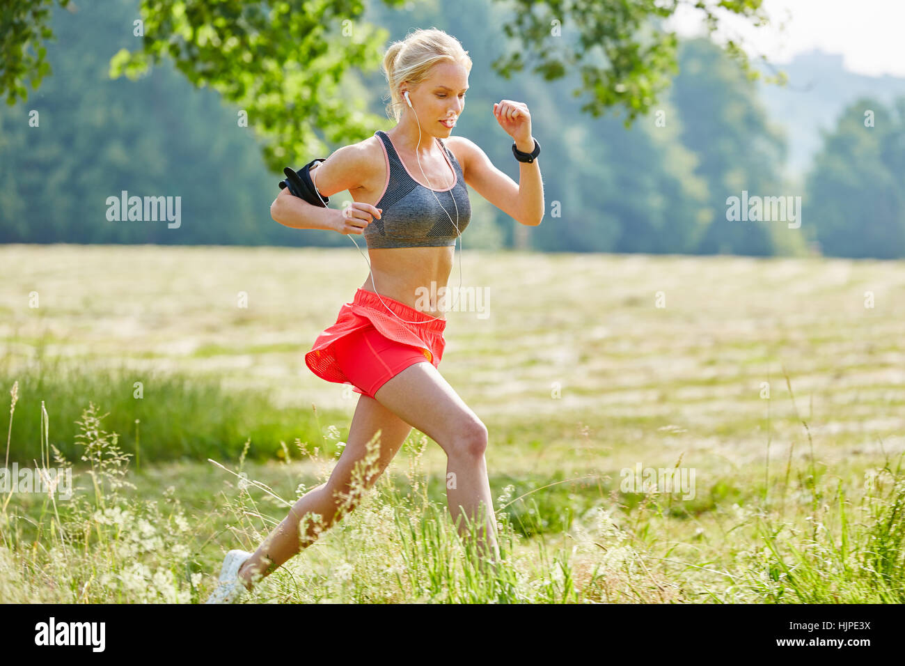 Young woman training hard with persistence for good performance Stock Photo