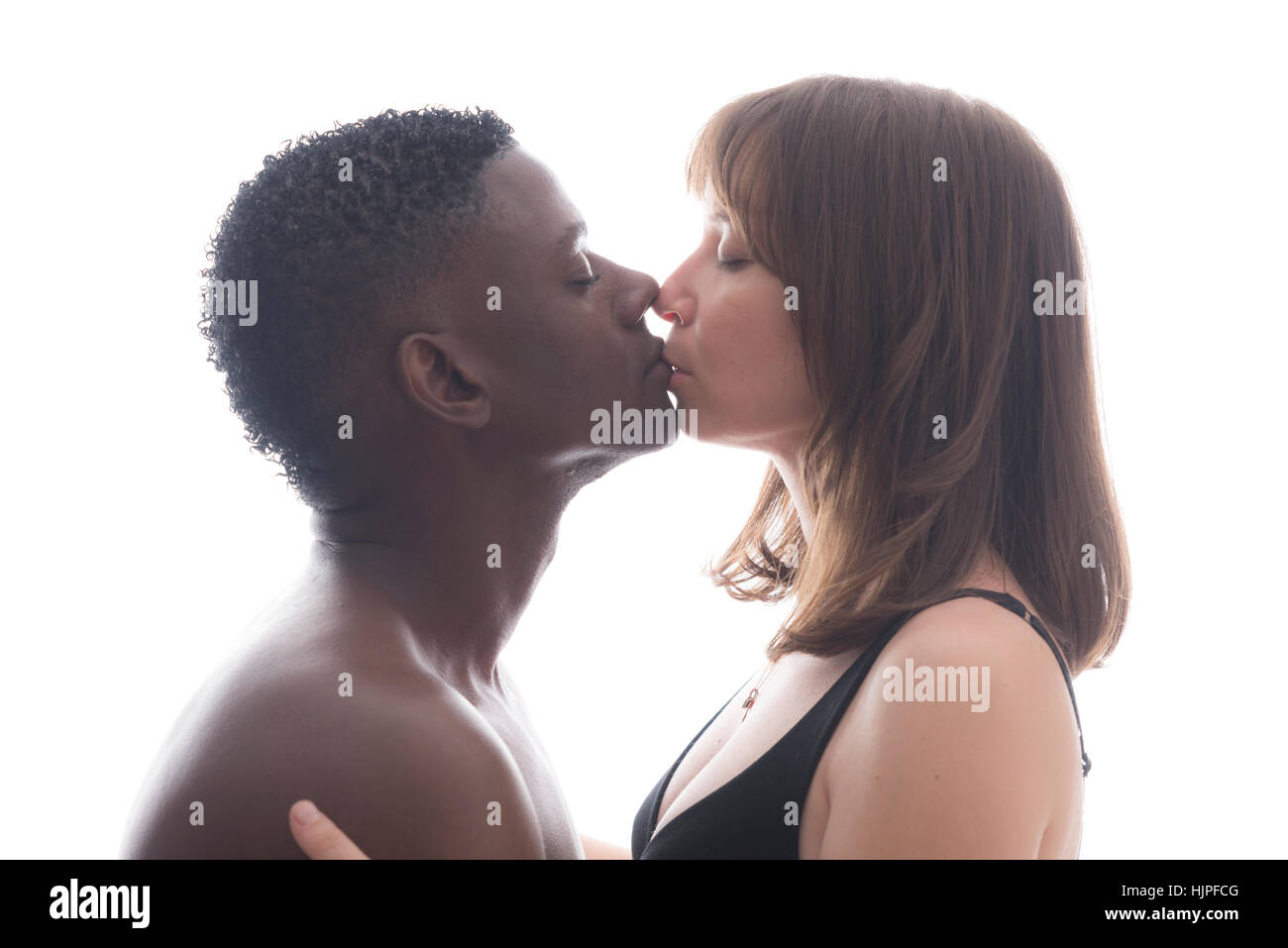 Loving African American caucasian couple kissing Stock Photo