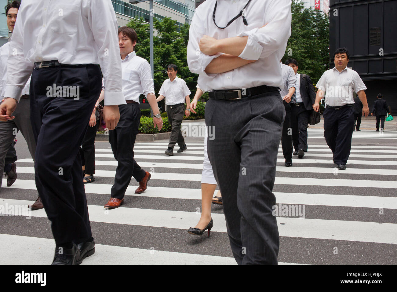 pedestrian crossing, pelican crossing, Businessmen in a crosswalk, lunch time, in Nishi Shinjuku.Shinjuku,Tokyo city, Japan, Asia Stock Photo