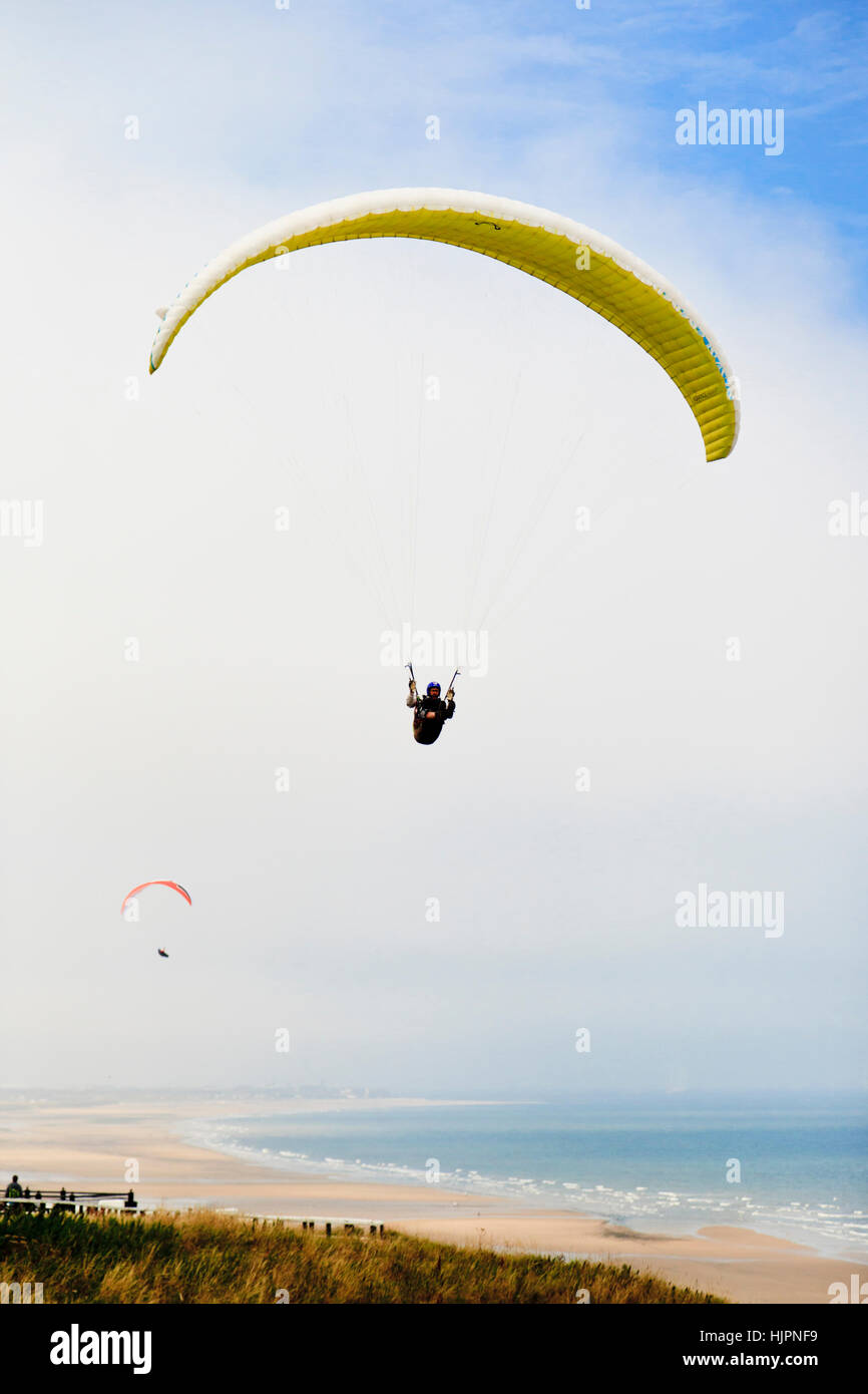 Two paragliders above Saltburn Beach, North Yorkshire, England Stock