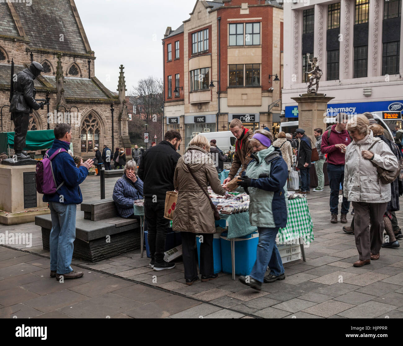 A busy market place in Durham city centre in north east England Stock Photo