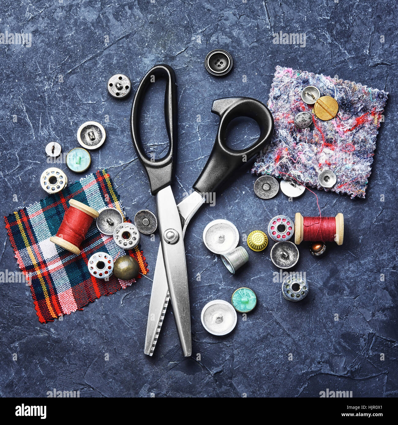 Tailor cutting fabrics hi-res stock photography and images - Alamy