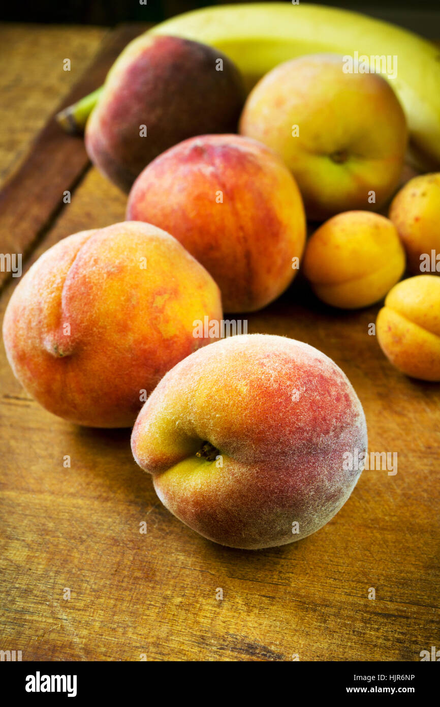 Beautiful fresh peaches, apricots and bananas Stock Photo Alamy